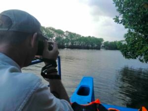 Marcus capturing a photo of giant elephants during our Pottuvil Lagoon Tour.