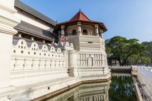 Scenic view of the Temple of the Tooth Relic in Kandy during a Highland experience, featured in Day Tours from Alagambe by Arugambay Agenda